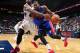 ATLANTA, GA - APRIL 8: Greg Monroe #10 of the Detroit Pistons drives to the basket during the game against Elton Brand #42 of the Detroit Pistons on April 8, 2014 at Philips Arena in Atlanta, Georgia. NOTE TO USER: User expressly acknowledges and agrees
