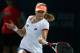 DUBAI, UNITED ARAB EMIRATES - FEBRUARY 18: Ekaterina Makarova of Russia in action against Serena Williams of the USA during day two of the WTA Dubai Duty Free Tennis Championship at the Dubai Tennis Stadium on February 18, 2014 in Dubai, United Arab Em