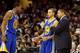 CLEVELAND, OH - DECEMBER 29: Head coach Mark Jackson of the Golden State Warriors speaks to Andre Iguodala #9 and Stephen Curry #30 of the Golden State Warriors in the fourth quarter against the Cleveland Cavaliers at Quicken Loans Arena on December 29, 2