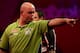 LONDON, ENGLAND - DECEMBER 30: Michael van Gerwen of The Netherlands celebrates winning the fourth set during his semi final match against Adrian Lewis on day fifteen of the Ladbrokes.com World Darts Championship at Alexandra Palace on December 30, 2013 i