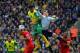 NORWICH, ENGLAND - APRIL 20: Simon Mignolet of Liverpool fails to punch the ball clear during the Barclays Premier League match between Norwich City and Liverpool at Carrow Road on April 20, 2014 in Norwich, England. (Photo by Michael Regan/Getty Images)