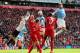 LIVERPOOL, ENGLAND - APRIL 13: Javi Garcia of Manchester City heads at goal past the dive of Simon Mignolet of Liverpool during the Barclays Premier League match between Liverpool and Manchester City at Anfield on April 13, 2014 in Liverpool, England. (