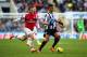 NEWCASTLE UPON TYNE, ENGLAND - DECEMBER 29: Hatem Ben Arfa of Newcastle United is closed down by Jack Wilshere of Arsenal during the Barclays Premier League match between Newcastle United and Arsenal at St James' Park on December 29, 2013 in Newcastle upo