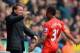 NORWICH, ENGLAND - APRIL 20: Raheem Sterling of Liverpool celebrates scoring the opening goal with Manager Brendan Rodgers of Liverpool during the Barclays Premier League match between Norwich City and Liverpool at Carrow Road on April 20, 2014 in Norwic