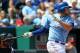 KANSAS CITY, MO - APRIL 19: Mike Moustakas #8 of the Kansas City Royals hits a sacrifice fly in the fourth inning against the Minnesota Twins at Kauffman Stadium on April 19, 2014 in Kansas City, Missouri. (Photo by Ed Zurga/Getty Images)