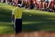 AUGUSTA, GA - APRIL 12: Tiger Woods of the United States drops his ball after he hits it into the water on the 15th hole during the second round of the 2013 Masters Tournament at Augusta National Golf Club on April 12, 2013 in Augusta, Georgia. (Photo b