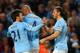 MANCHESTER, ENGLAND - APRIL 21: Martin Demichelis of Manchester City (R) celebrates with David Silva (21) and Vincent Kompany (4) as he scores their third goal during the Barclays Premier League match between Manchester City and West Bromwich Albion at E