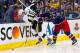COLUMBUS, OH - APRIL 21: James Wisniewski #21 of the Columbus Blue Jackets checks James Neal #18 of the Pittsburgh Penguins while battling for control of the puck during the third period in Game Three of the First Round of the 2014 NHL Stanley Cup Playof