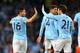 MANCHESTER, ENGLAND - APRIL 21: Sergio Aguero of Manchester City celebrates with David Silva after scoring the second goal during the Barclays Premier League match between Manchester City and West Bromwich Albion at Etihad Stadium on April 21, 2014 in Ma