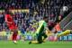 NORWICH, ENGLAND - APRIL 20: Raheem Sterling of Liverpool scores their third goal during the Barclays Premier League match between Norwich City and Liverpool at Carrow Road on April 20, 2014 in Norwich, England. (Photo by Jamie McDonald/Getty Images)