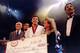 Jiu-Jitsu black belt Royce Gracie (USA) receives a $50,000 check after becoming 'The Ultimate Fighter' by defeating Gerard Gordeau of the Netherlands int he finals of the Ultimate Fighter Championships in Denver, Colorado. Mandatory Credit: Markus Boesch