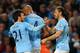 MANCHESTER, ENGLAND - APRIL 21: Martin Demichelis of Manchester City (R) celebrates with David Silva (21) and Vincent Kompany (4) as he scores their third goal during the Barclays Premier League match between Manchester City and West Bromwich Albion at E
