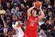 PORTLAND, OR - APRIL 7: Dario Saric #12 of the World Select Team passes against Shabazz Muhammad #10 of the USA Junior Select Team during the 2012 Hoop Summit on April 7, 2012 at the Rose Garden Arena in Portland, Oregon. NOTE TO USER: User expressly ackn