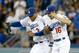 LOS ANGELES, CA - APRIL 19: Carl Crawford #3, Andre Ethier #16 and Matt Kemp #27 of the Los Angeles Dodgers celebrate an 8-6 win over the Arizona Diamondbacks at Dodger Stadium on April 19, 2014 in Los Angeles, California. (Photo by Harry How/Getty Imag