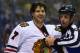 ST. LOUIS, MO - APRIL 19: Referee Brad Kovachick #71 restrains Brent Seabrook #7 of the Chicago Blackhawks who laughs after lying out David Backes #42 of the St. Louis Blues in Game Two of the First Round of the 2014 Stanley Cup Playoffs at the Scottrade