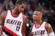 PORTLAND, OR - JANUARY 28: LaMarcus Aldridge #12 and Damian Lillard #0 of the Portland Trail Blazers talk against the Memphis Grizzlies on January 28, 2014 at the Moda Center Arena in Portland, Oregon. NOTE TO USER: User expressly acknowledges and agrees