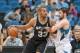 Apr 8, 2014; Minneapolis, MN, USA; San Antonio Spurs forward Boris Diaw (33) dribbles against Minnesota Timberwolves forward Kevin Love (42) at Target Center. Mandatory Credit: Brad Rempel-USA TODAY Sports