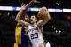 Apr 16, 2014; San Antonio, TX, USA; San Antonio Spurs guard Manu Ginobili (20) drives to the basket under pressure from Los Angeles Lakers forward Jordan Hill (behind) during the second half at AT&T Center. The Lakers won 113-100. Mandatory Credit: Soobum