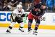 COLUMBUS, OH - APRIL 21: R.J. Umberger #18 of the Columbus Blue Jackets skates with the puck as Sidney Crosby #87 of the Pittsburgh Penguins gives chase in Game Three of the First Round of the 2014 Stanley Cup Playoffs on April 21, 2014 at Nationwide Are