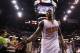 PHOENIX, AZ - APRIL 14: Eric Bledsoe #2 of the Phoenix Suns high fives fans as he walks off the court following the NBA game against the Memphis Grizzlies at US Airways Center on April 14, 2014 in Phoenix, Arizona. The Grizzlies defeated the Suns 97-91.