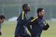 ST ALBANS, ENGLAND - FEBRUARY 18: Mikel Arteta (R) and Abou Diaby of Arsenal warm up during a training session ahead of their UEFA Champions League round of 16 first leg match against FC Bayern Muenchen at London Colney on February 18, 2013 in St Albans,