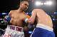 Mar 9, 2013; Brooklyn, NY, USA; Keith Thurman (red/white/blue trunks) and Jan Zaveck (blue trunks) trade punches during their 12 round WBO Inter-Continental Welterweight title bout at the Barclay's Center. Mandatory Credit: Ed Mulholland-USA TODAY Sports