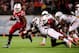 Dec 28, 2013; Orlando, FL, USA; Louisville Cardinals running back Dominique Brown (10) runs in the second quarter in the Russell Athletic Bowl against the Miami Hurricanes at Florida Citrus Bowl Stadium. Mandatory Credit: David Manning-USA TODAY Sports