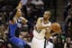 Apr 23, 2014; San Antonio, TX, USA; San Antonio Spurs guard Tony Parker (9) looks to pass the ball around Dallas Mavericks forward Shawn Marion (0) in game two during the first round of the 2014 NBA Playoffs at AT&T Center. Mandatory Credit: Soobum Im-USA