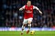 LONDON, ENGLAND - JANUARY 18: Mesut Oezil of Arsenal in action during the Barclays Premier League match between Arsenal and Fulham at Emirates Stadium on January 18, 2014 in London, England. (Photo by Clive Mason/Getty Images)