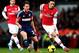 LONDON, ENGLAND - JANUARY 18: Mesut Oezil of Arsenal evades Scott Parker of Fulham during the Barclays Premier League match between Arsenal and Fulham at Emirates Stadium on January 18, 2014 in London, England. (Photo by Clive Mason/Getty Images)