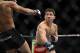 December 14, 2013; Sacramento, CA, USA; Demetrious Johnson (red gloves) fights Joseph Benavidez (blue gloves) during the flyweight championship bout of the UFC on FOX 9 at Sleep Train Arena. Mandatory Credit: Kyle Terada-USA TODAY Sports