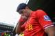 NORWICH, ENGLAND - APRIL 20: Luis Suarez of Liverpool kisses his hand as he walks out during the Barclays Premier League match between Norwich City and Liverpool at Carrow Road on April 20, 2014 in Norwich, England. (Photo by Michael Regan/Getty Images)