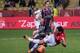 MONTE-CARLO, MONACO - DECEMBER 20: Monaco's foward Radamel Falcao (R) obtains a penalty on Valenciennes's defender Saliou Ciss (L) during the French L1 football match between AS Monaco vs Valenciennes at Louis II Stadium on December 20, 2013 in Monte-Ca