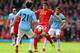 LIVERPOOL, ENGLAND - APRIL 13: Luis Suarez of Liverpool competes with Gael Clichy and David Silva of Manchester City uring the Barclays Premier League match between Liverpool and Manchester City at Anfield on April 13, 2014 in Liverpool, England. (Photo