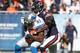 CHICAGO, IL - NOVEMBER 10: Charles Tillman #33 of the Chicago Bears tackles Calvin Johnson #81 of the Detroit Lions at Soldier Field on November 10, 2013 in Chicago, Illinois. The Lions defeated the Bears 21-19. (Photo by Jonathan Daniel/Getty Images)