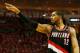 HOUSTON, TX - APRIL 23: LaMarcus Aldridge #12 of the Portland Trail Blazers celebrates a play on the court in the second half of the game against the Houston Rockets in Game Two of the Western Conference Quarterfinals during the 2014 NBA Playoffs at Toyo