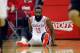HOUSTON, TX - APRIL 20: James Harden #13 of the Houston Rockets falls to the floor during game action in Game One of the Western Conference Quarterfinals during the 2014 NBA Playoffs at the Toyota Center on April 20, 2014 in Houston, Texas. NOTE TO USER: