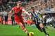 NEWCASTLE UPON TYNE, ENGLAND - DECEMBER 14: Hatem Ben Arfa of Newcastle United looks to get around Calum Chambers of Southampton during the Barclays Premier League match between Newcastle United and Southampton at St James' Park on December 14, 2013 in N