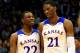 LAWRENCE, KS - NOVEMBER 22: Andrew Wiggins #22 of the Kansas Jayhawks talks with Joel Embiid #21 as they walk onto the floor after a timeout during the game against the Towson Tigers at Allen Fieldhouse on November 22, 2013 in Lawrence, Kansas. (Photo by