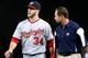 LOS ANGELES, CA - MAY 13: Right fielder Bryce Harper #34 of the Washington Nationals walks off the field with trainer Lee Kuntz as he bleeds from the neck after running into the wall chasiing a triple hit by A.J. Ellis of the Los Angeles Dodgers in the f