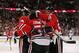 CHICAGO, IL - APRIL 23: Corey Crawford #50 of the Chicago Blackhawks gets a hug from teammates Niklas Hjlamarsson #4 (L) and Michal Handzus #26 after a win against the St. Louis Blues in Game Four of the First Round of the 2014 NHL Stanley Cup Playoffs at