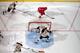 DETROIT, MI - APRIL 22: Tomas Tatar #21 of the Detroit Red Wings skates with the puck as goalie Tuukka Rask #40 of the Boston Bruins covers the net and teammates Brad Marchand #63, Matt Bartkowski #43, David Krejci #46 and Reilly Smith #18 all close in o