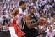 TORONTO, ON - APRIL 22: Joe Johnson #7 of the Brooklyn Nets drives against DeMar DeRozan #10 of the Toronto Raptors in Game Two of the Eastern Conference Quarterfinals at the Air Canada Centre on April 22, 2014 in Toronto, Ontario, Canada. NOTE TO USER: