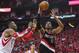 Apr 20, 2014; Houston, TX, USA; Portland Trail Blazers forward LaMarcus Aldridge (12) shoots the ball as Houston Rockets center Dwight Howard (12) defends during the second quarter in game one during the first round of the 2014 NBA Playoffs at Toyota Cent