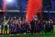 BARCELONA, SPAIN - MAY 19: Head coach Tito Vilanova and Eric Abidal of FC Barcelona holds up the trophy during the celebration after winning the Spanish League after the La Liga match between FC Barcelona and Real Valladolid CF at Camp Nou on May 19, 201