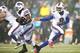 FOXBORO, MA - DECEMBER 29: Thad Lewis #9 of the Buffalo Bills hands the ball off to teammate C.J. Spiller #28 in the second half against the New England Patriots during the game at Gillette Stadium on December 29, 2013 in Foxboro, Massachusetts. (Photo b