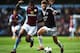 BIRMINGHAM, ENGLAND - APRIL 19: (L-R) Leandro Bacuna of Aston Villa and Adam Lallana of Southampton challenge for the ball during the Barclays Premier League match between Aston Villa and Southampton at Villa Park on April 19, 2014 in Birmingham, England