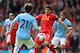 LIVERPOOL, ENGLAND - APRIL 13: Luis Suarez of Liverpool competes with Gael Clichy and David Silva of Manchester City uring the Barclays Premier League match between Liverpool and Manchester City at Anfield on April 13, 2014 in Liverpool, England. (Photo