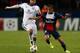 PARIS, FRANCE - NOVEMBER 05: Lucas of PSG is tackled by Anthony Vanden Borre of Anderlecht during the UEFA Champions League Group C match between Paris Saint Germain and RSC Anderlecht at Parc des Princes on November 5, 2013 in Paris, France. (Photo by