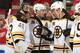 DETROIT, MI - APRIL 22: Jarome Iginla #12 and David Krejci #46 congratulate teammate Tuukka Rask #40 on his shutout win after Game Three of the First Round of the 2014 Stanley Cup Playoffs against the Detroit Red Wings on April 22, 2014 at Joe Louis Aren